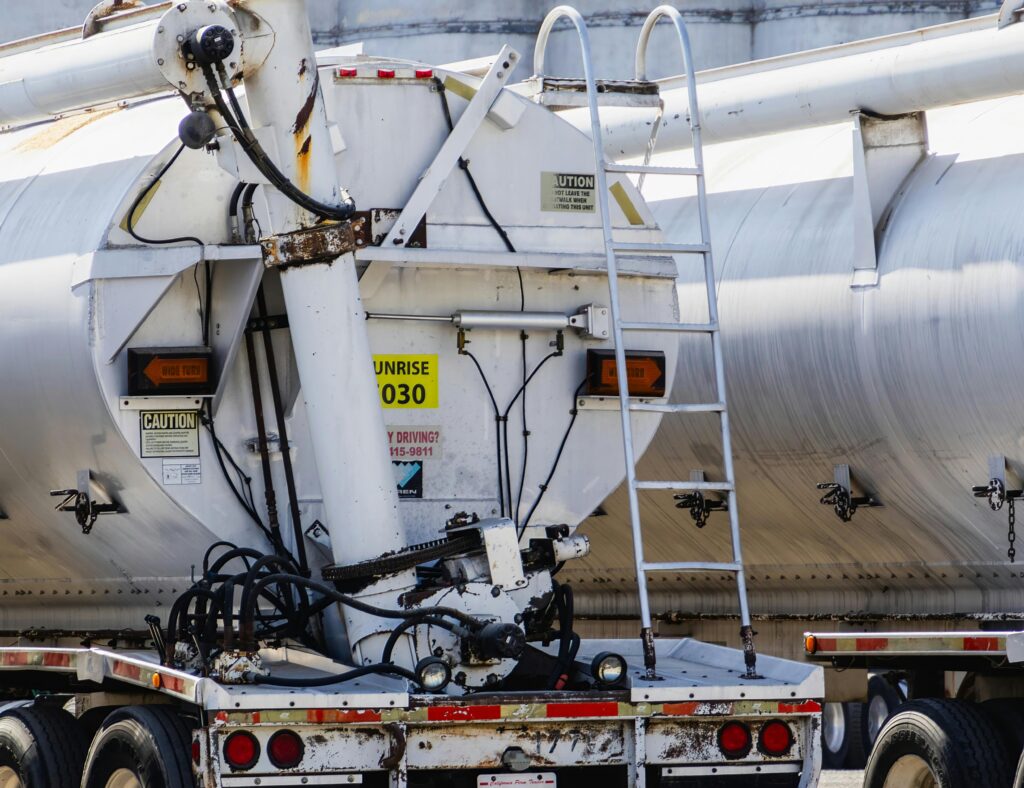 Fuel tanker delivery at a station.